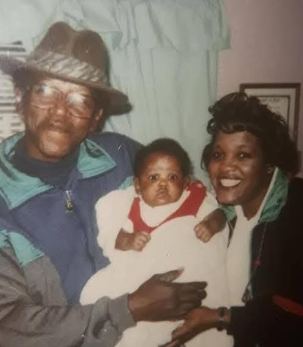 Grandparents holding a baby